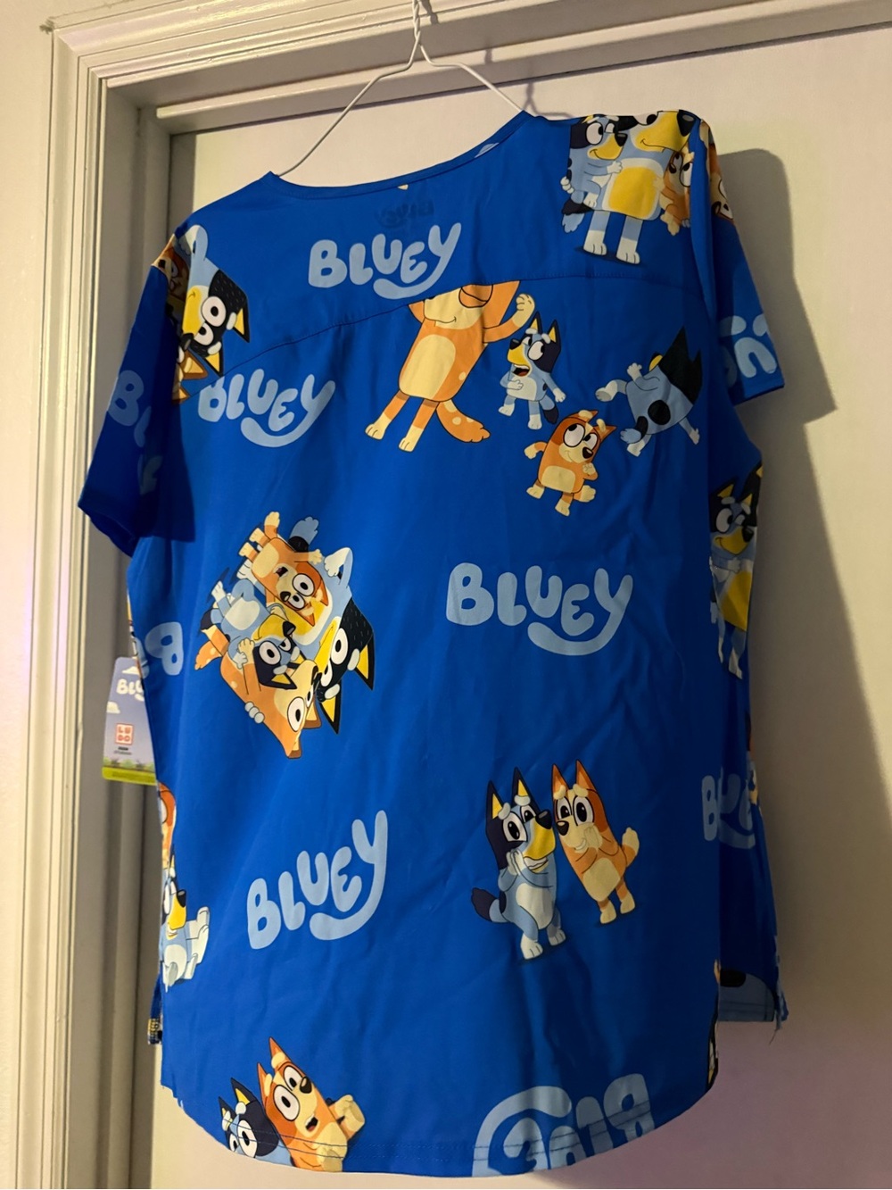 NEW Bluey Women's Scrub top with 2 pockets in front.